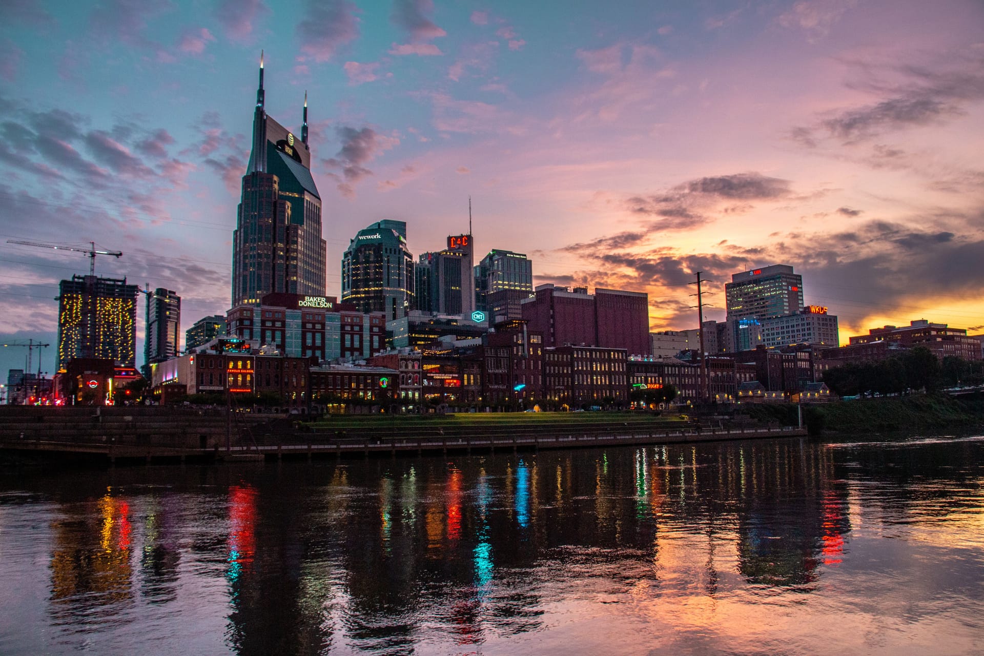 The downtown Nashville skyline at sunset over the Cumberland River